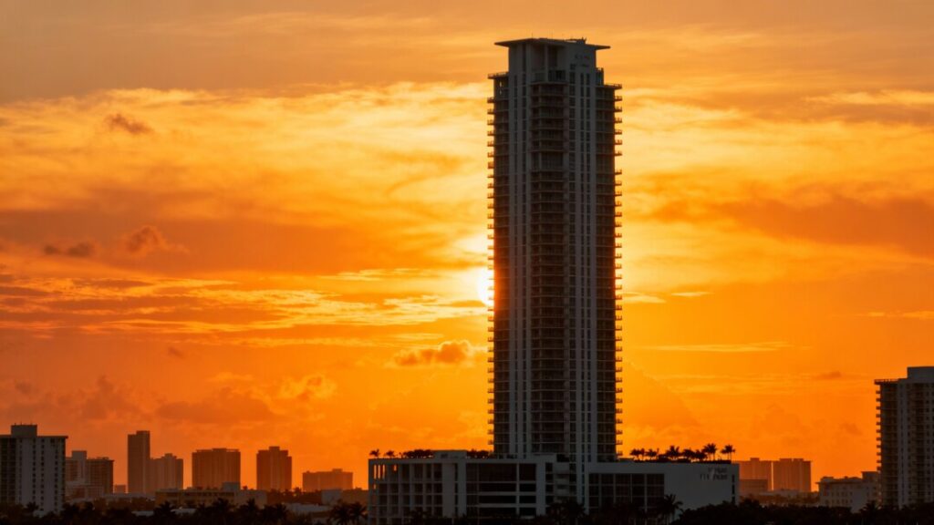 The iconic 48-story Five Park tower, the tallest in Miami Beach, against a sunset sky