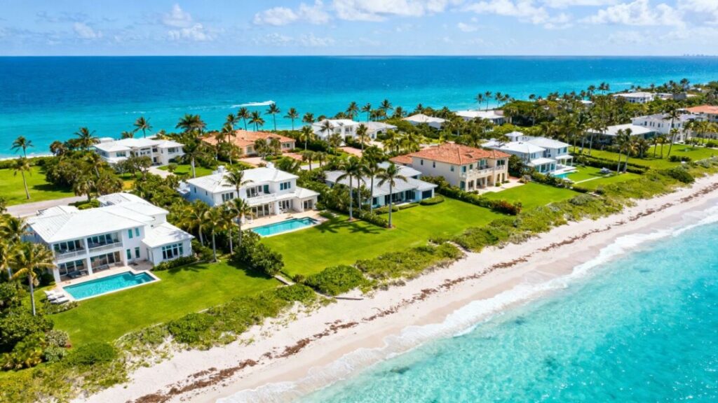 Palm Beach waterfront homes with palm trees and ocean