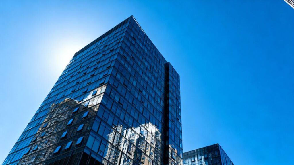 Modern skyscraper in Miami with glass facade.