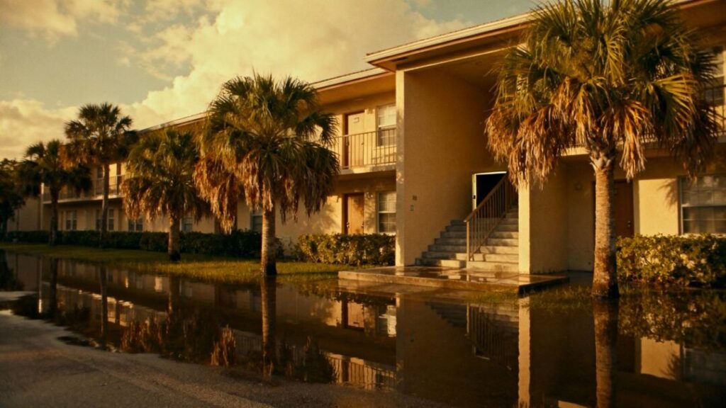 Florida apartment building with floodwater at entrance
