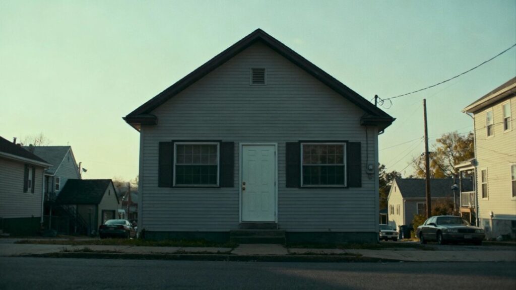 House with closed door on a quiet street.