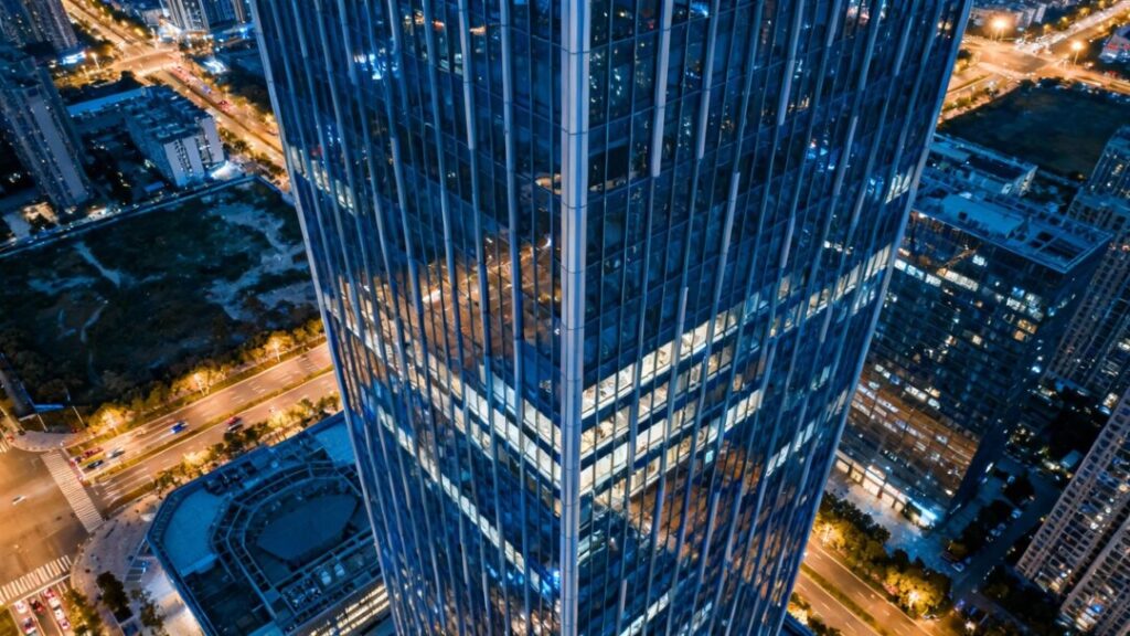 Architectural rendering of a tall skyscraper in a city.