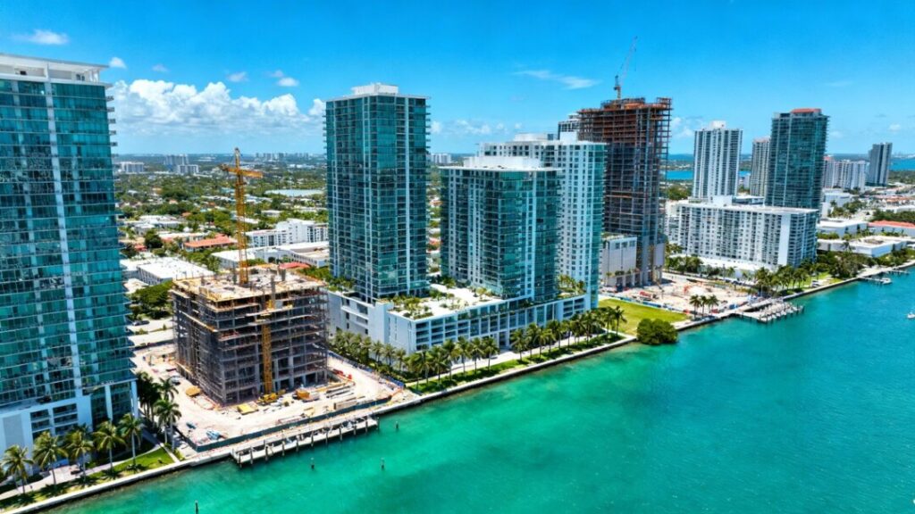Florida city skyline with condos, palm trees, water