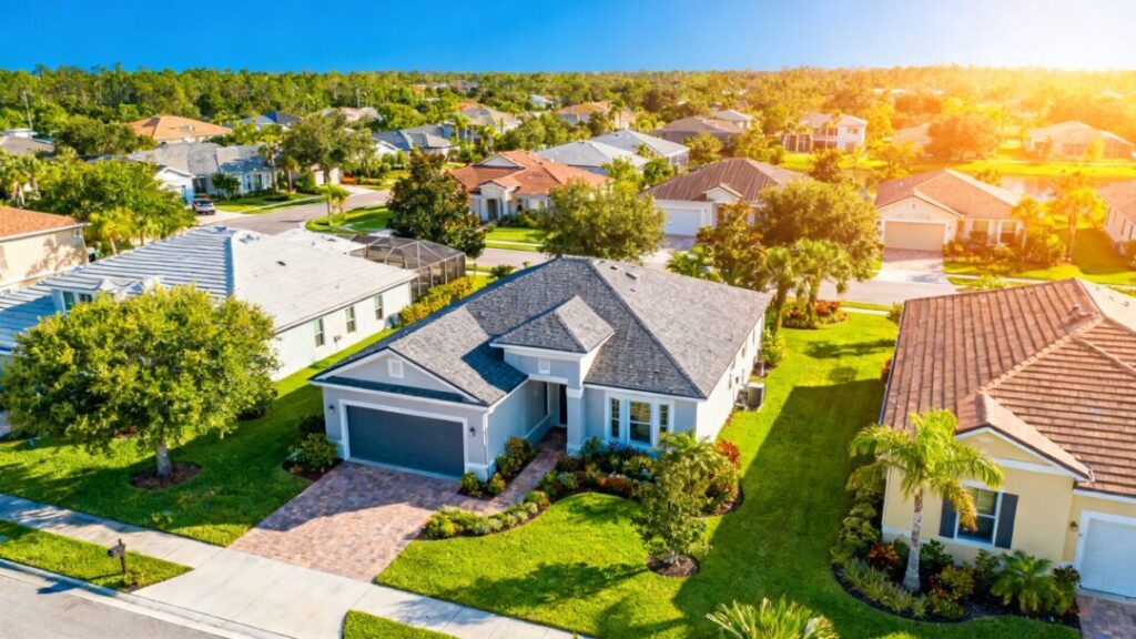 Central Florida homes under a bright blue sky.