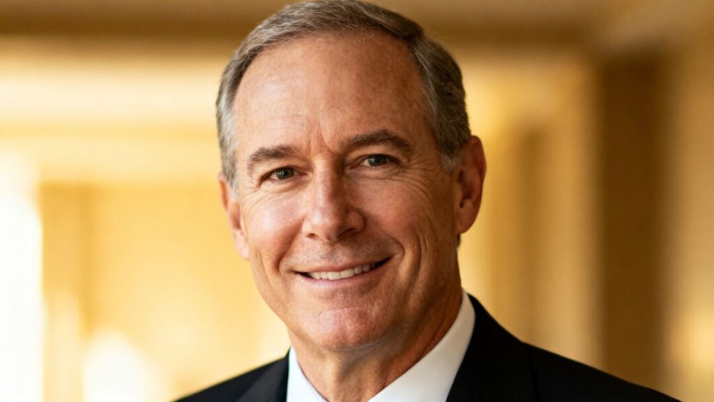 Charles Sowers in professional attire, smiling confidently.