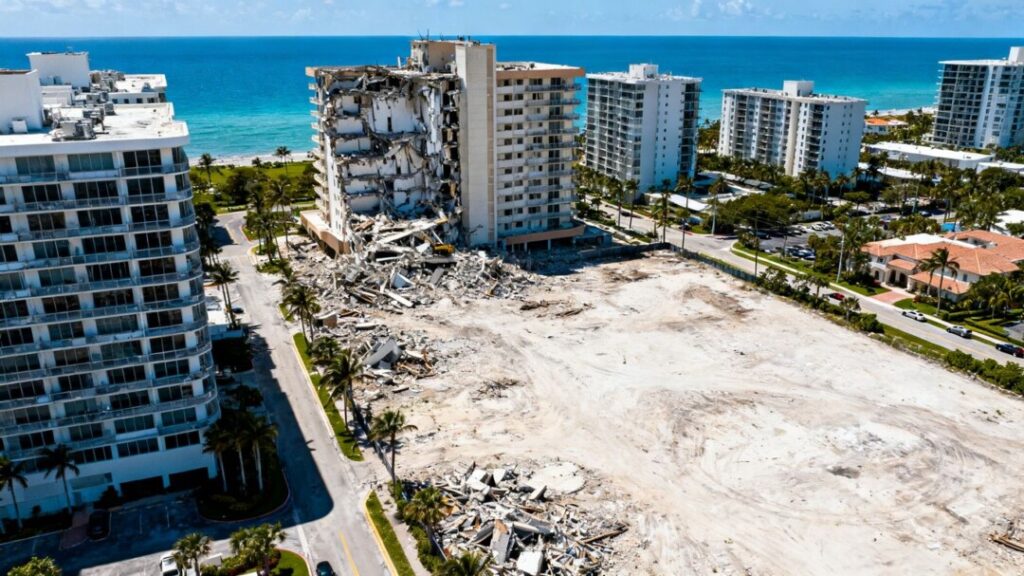 Surfside condo collapse site next to intact luxury buildings.