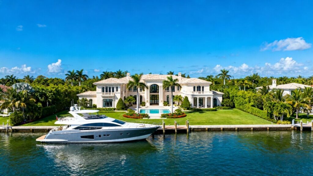 Luxury South Florida mansion with waterfront view and yacht.