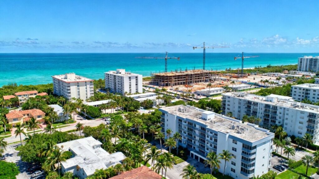 South Florida coastline with new real estate development and cranes.