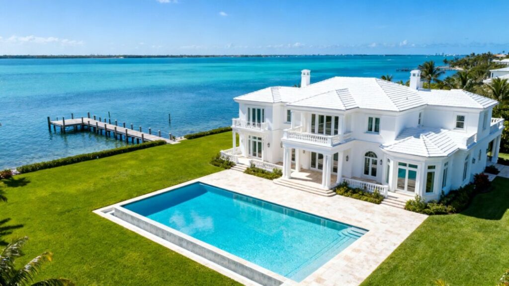 Luxury waterfront mansion with pool and private dock.