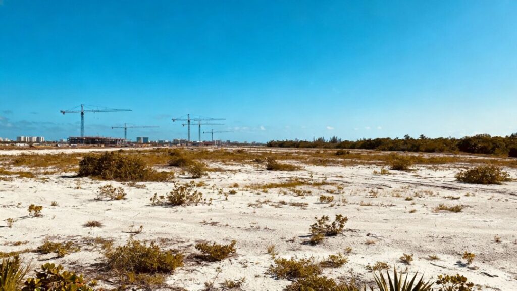 Fort Lauderdale development site with construction cranes in background.