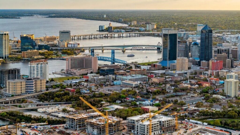 Jacksonville skyline and riverfront construction site in warm sunlight