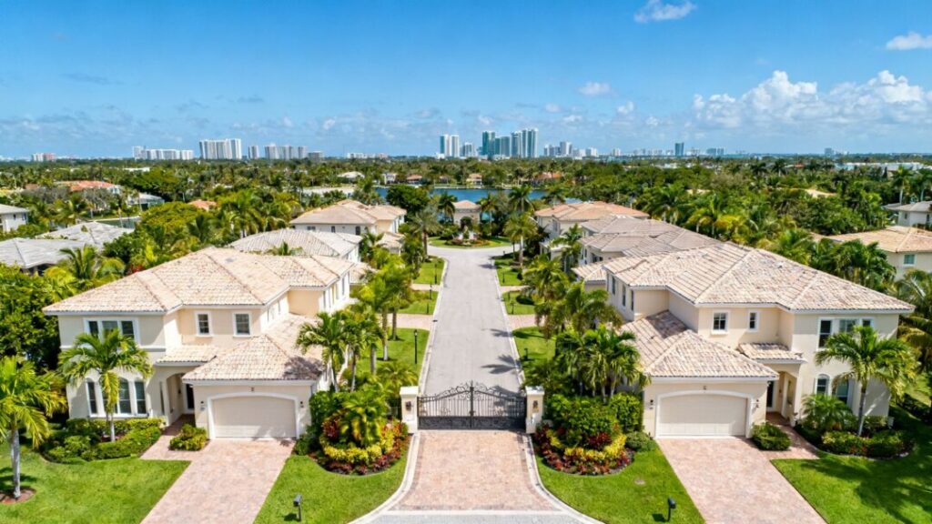 Gated new homes with tropical landscaping in Aventura, Florida