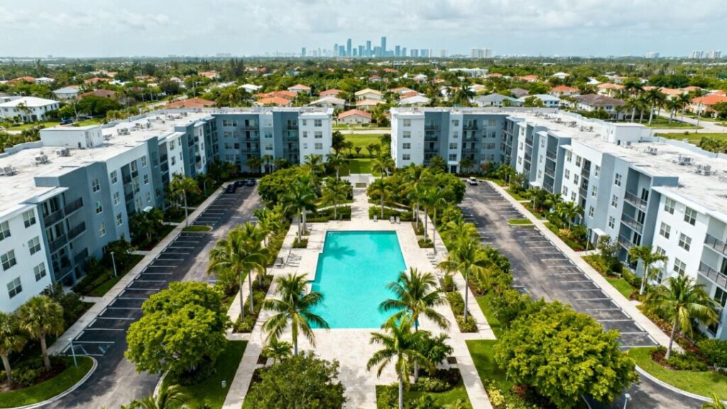 Doral apartment community with tropical landscaping and a swimming pool